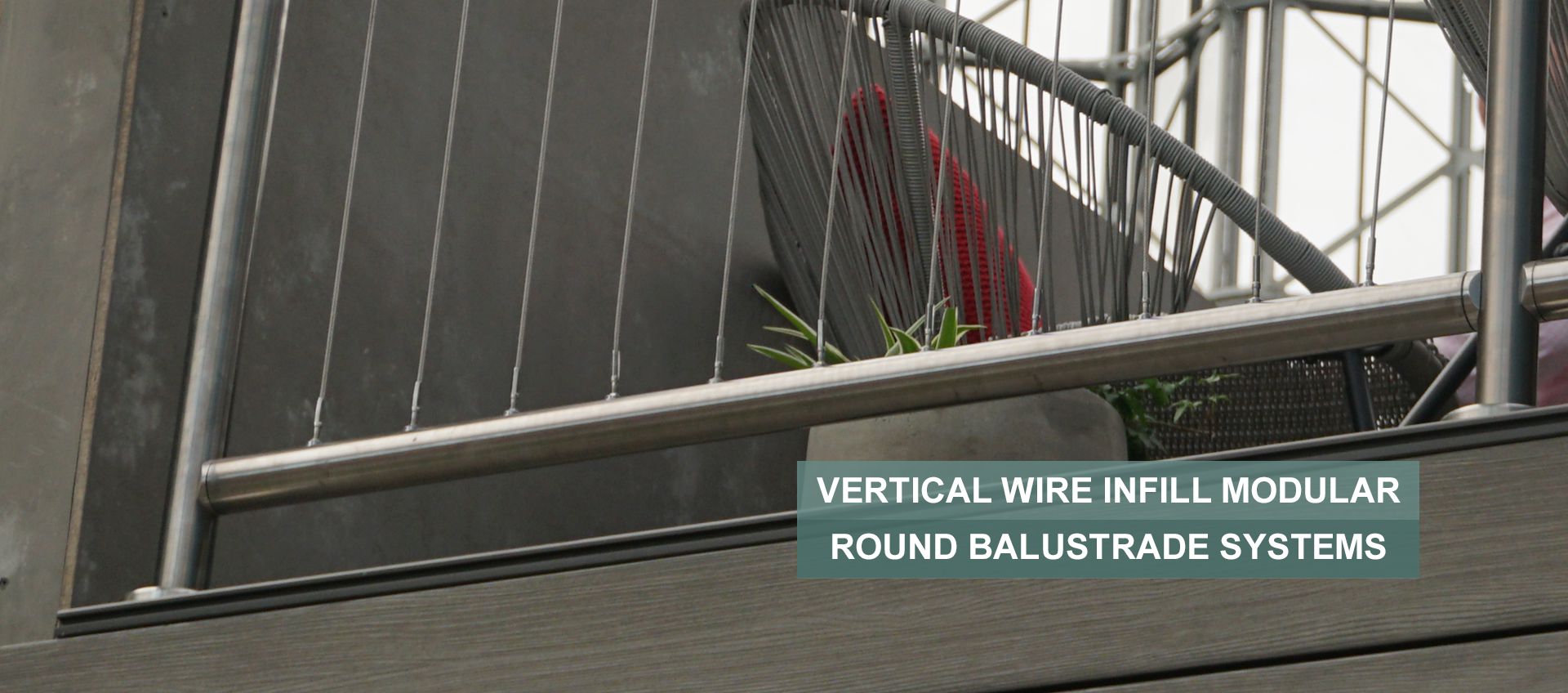 Vertical wire rope infill balustrade on a balcony