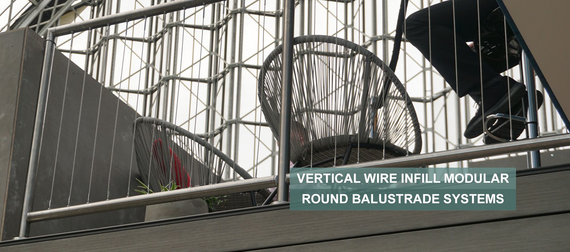 Vertical wire rope infill balustrade on a balcony