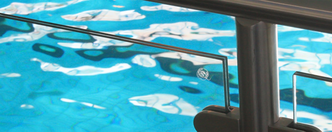 glass balustrade surrounding swimming pool
